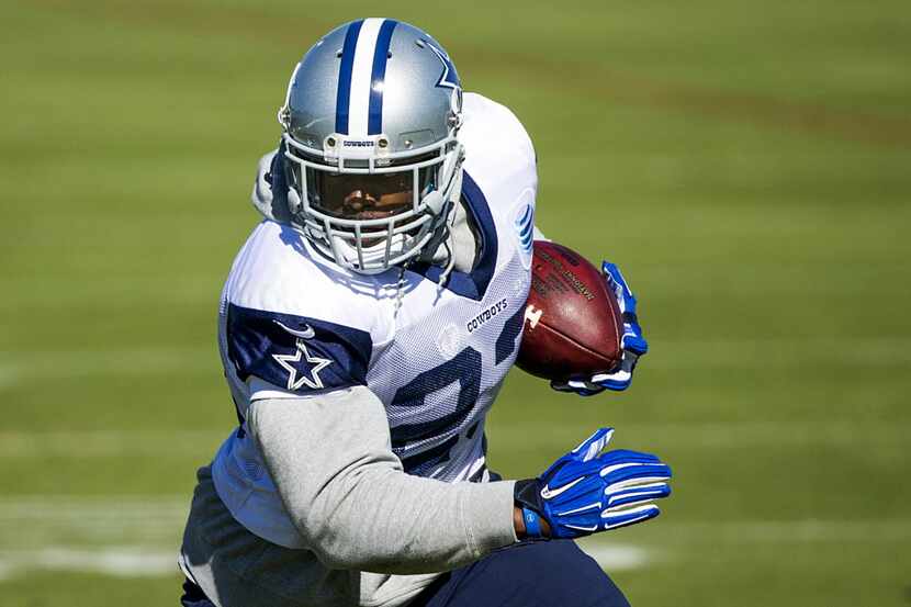 Dallas Cowboys running back Robert Turbin (23) runs with the ball during practice at the...