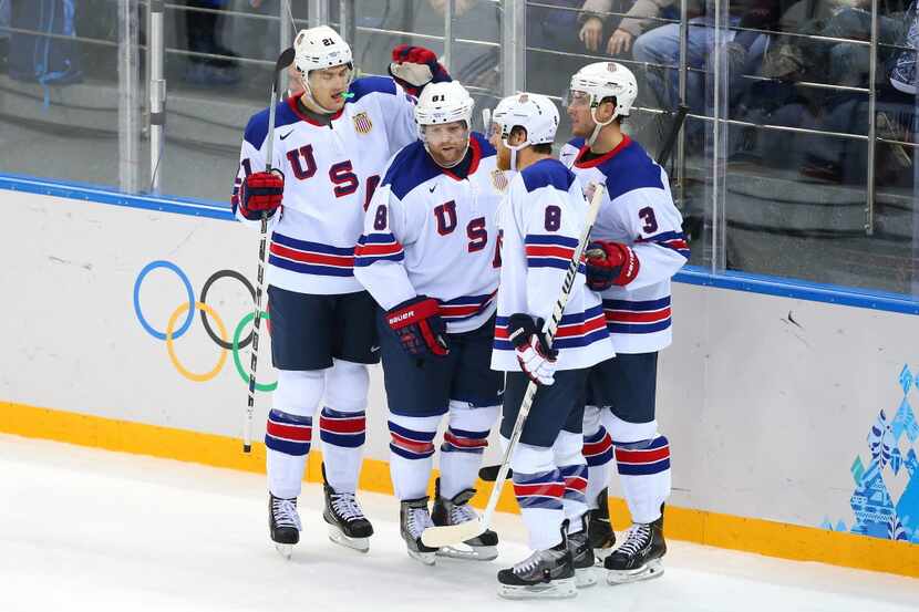 SOCHI, RUSSIA - FEBRUARY 16: Phil Kessel #81 of the United States celebrates his third goal...