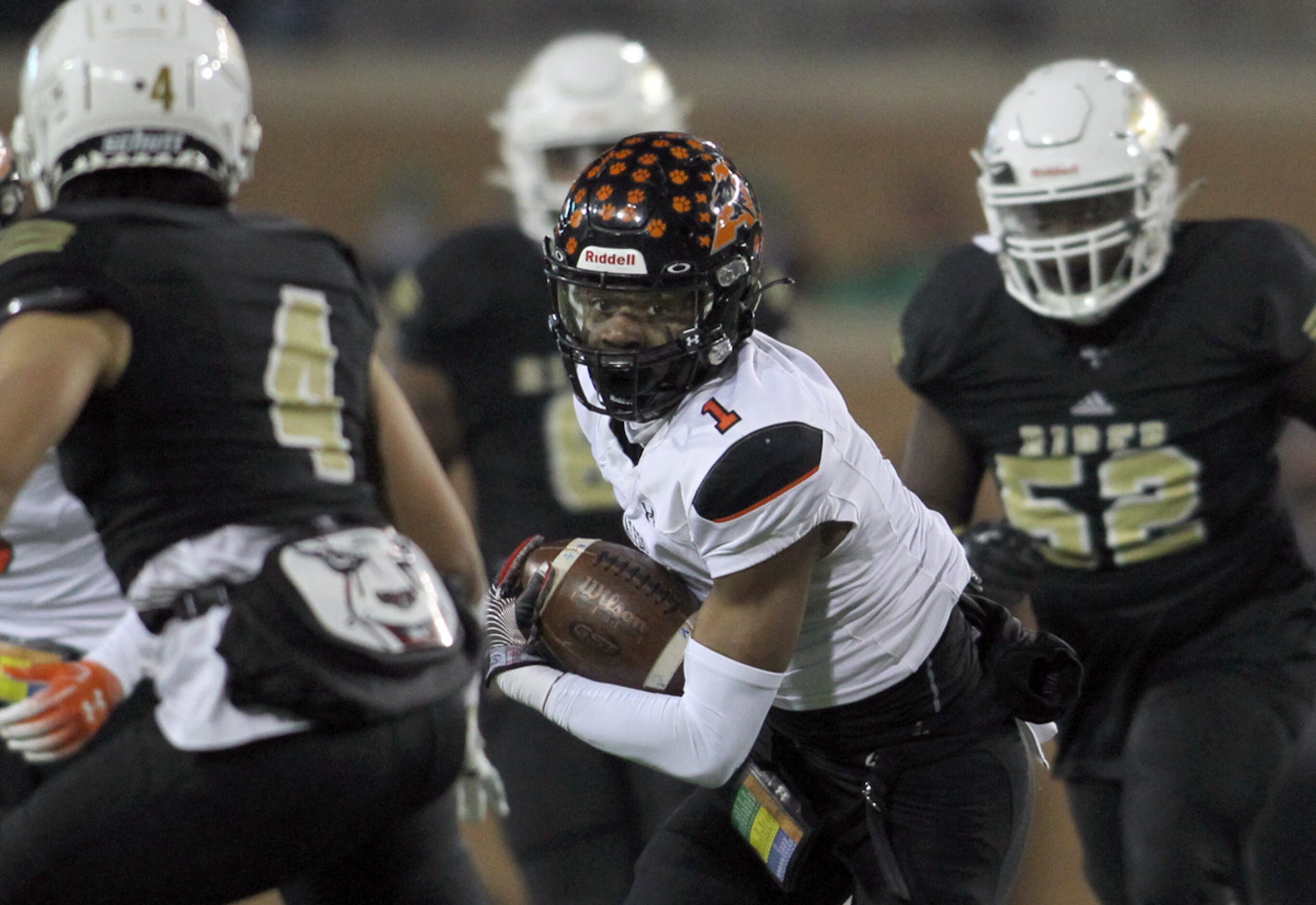 Aledo receiver JoJo Earle (1) eyes the defense of Wichita Falls Rider Dominique Horton (4)...