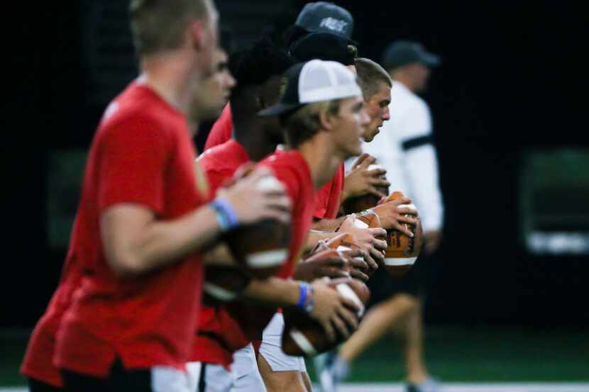 Quarterbacks warm up before the Elite 11 at The Star on Sunday, June 30, 2019. The Elite 11...