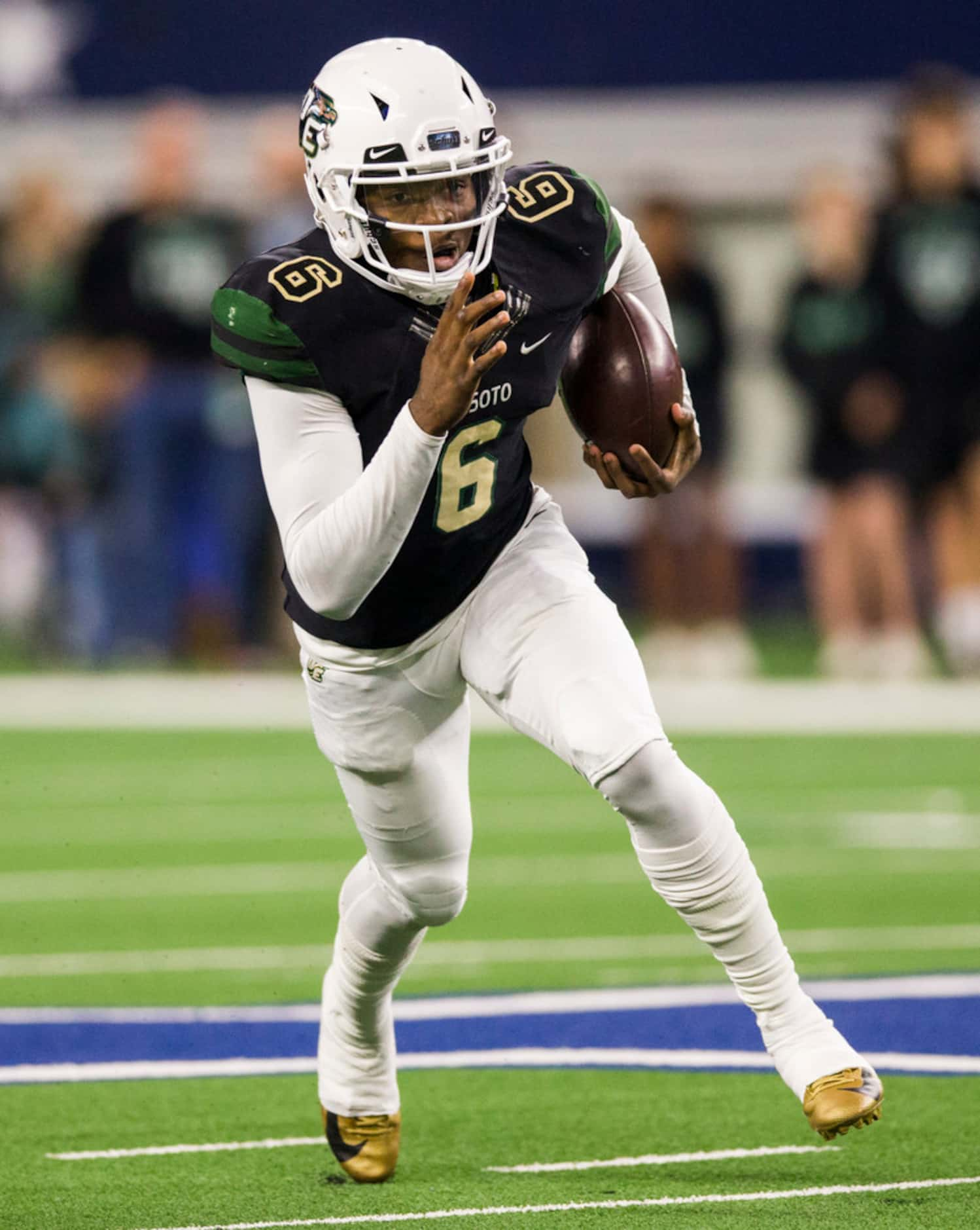 DeSoto quarterback Samari Collier (6) runs the ball during the first quarter of a Class 6A...