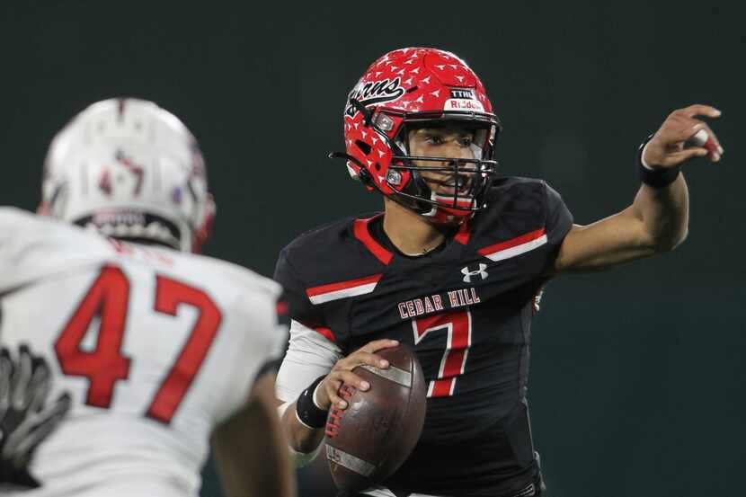 Cedar Hill quarterback Kaidon Salter (7) redirects the route for receiver Javien Clemmer...