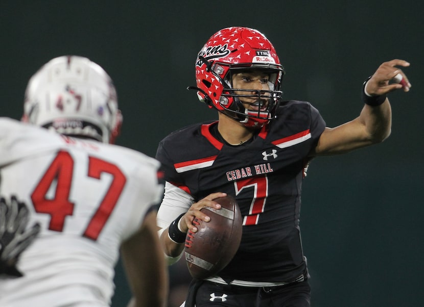 Cedar Hill quarterback Kaidon Salter (7) redirects the route for receiver Javien Clemmer...