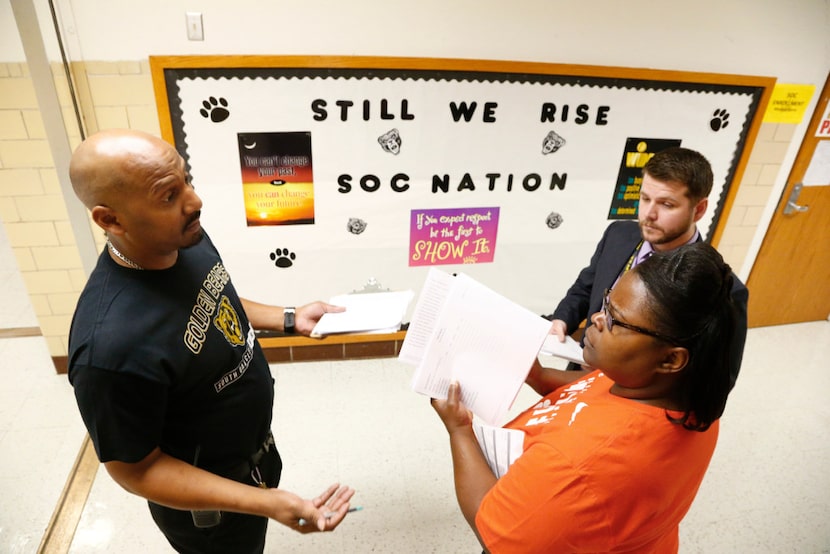 Dr. Willie Johnson (from left)  talks to assistant principal Marsha Potts and geography...