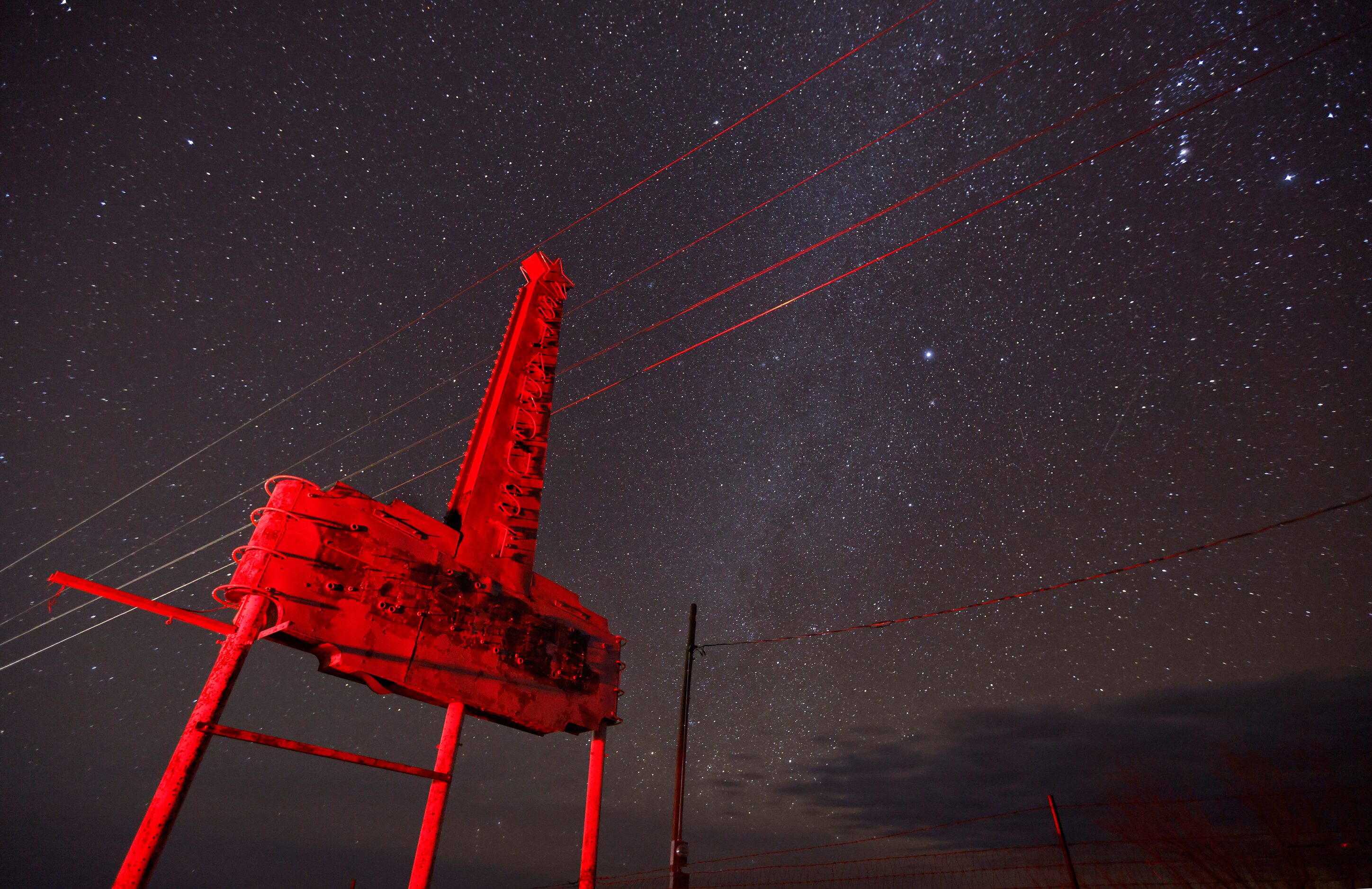 During a new moon, the star-filled dark skies of Far West Texas are seen behind the old...