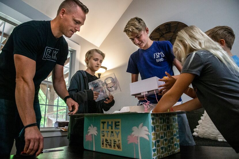 Match affinity design team lead James Walker (left) and his children Cade, 11, Boston, 14,...