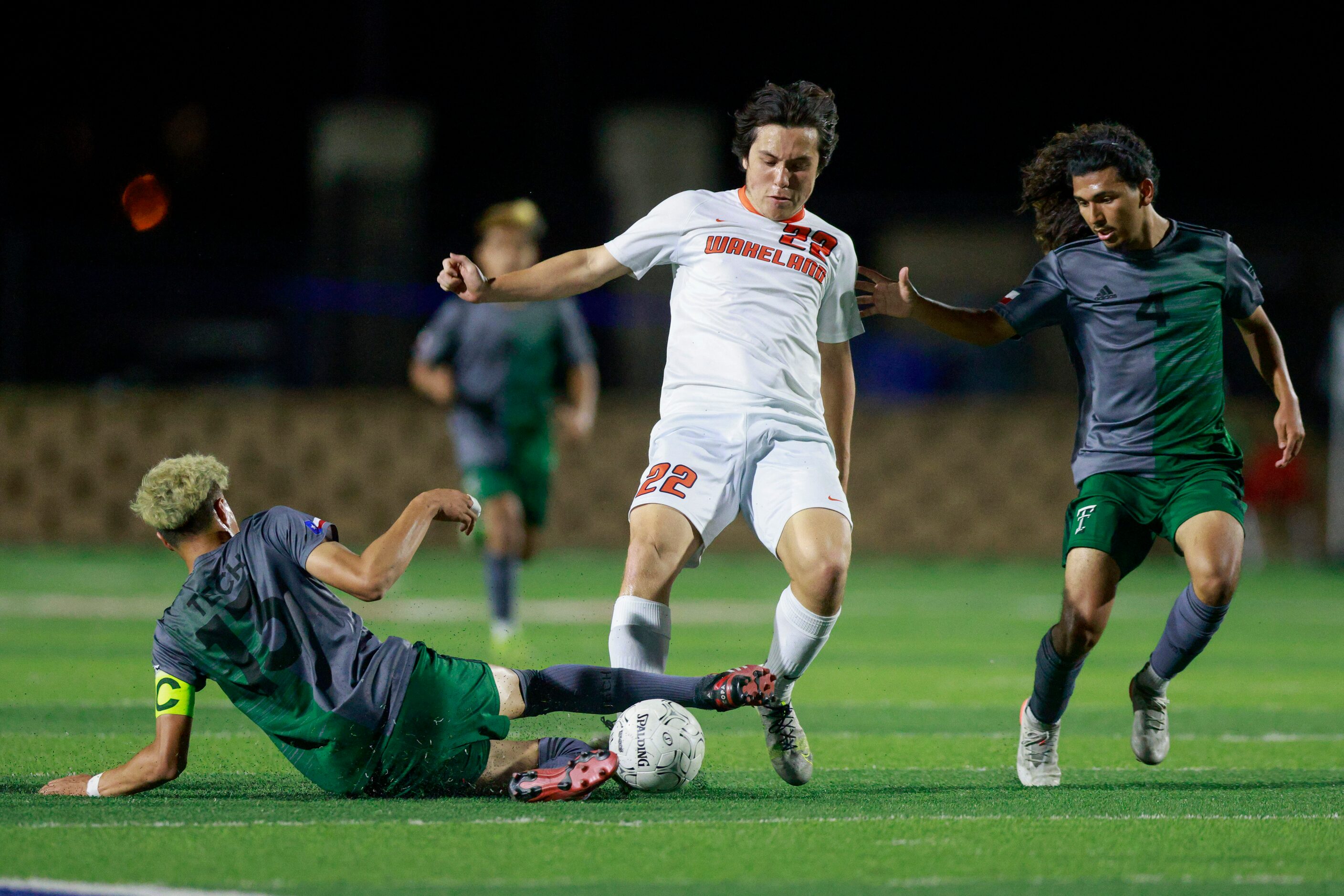 Fort Worth Trimble Tech Defender Benjamin Jimenez (13) slide tackles Frisco Wakeland forward...