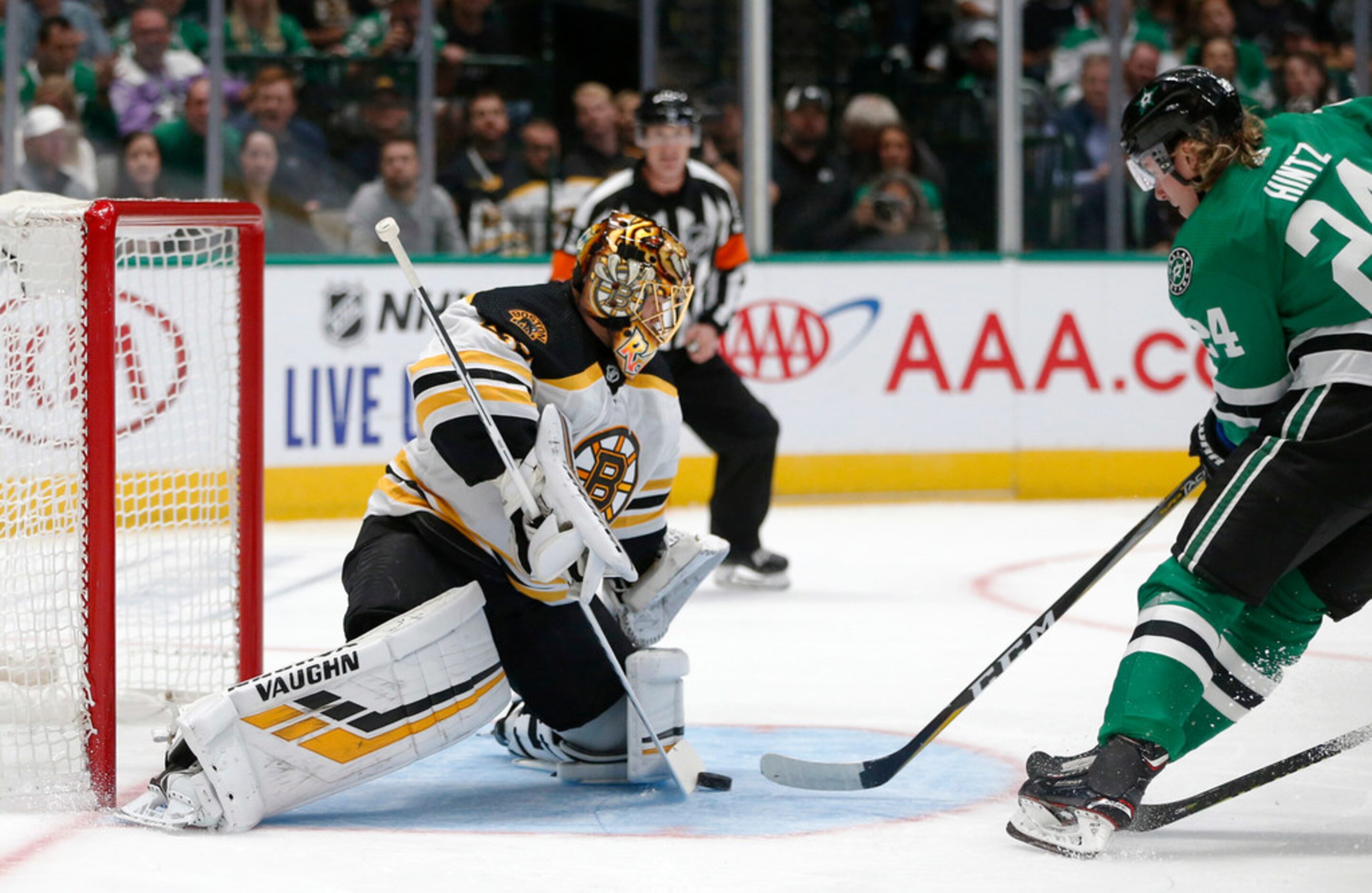 Boston Bruins goaltender Tuukka Rask (40) stops a shot as Dallas Stars left wing Roope Hintz...