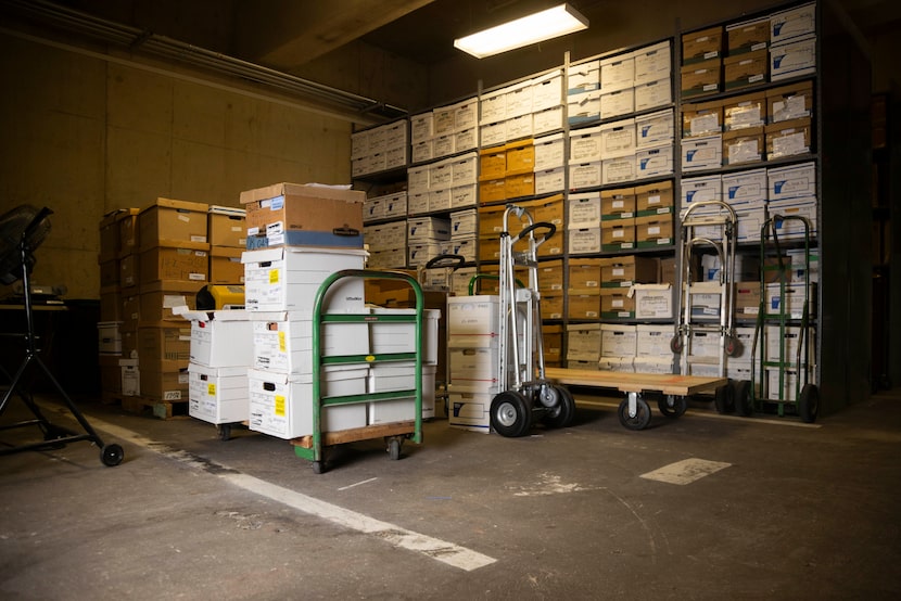 Boxes sit organized over the white lines of a portion of the underground parking lot at...