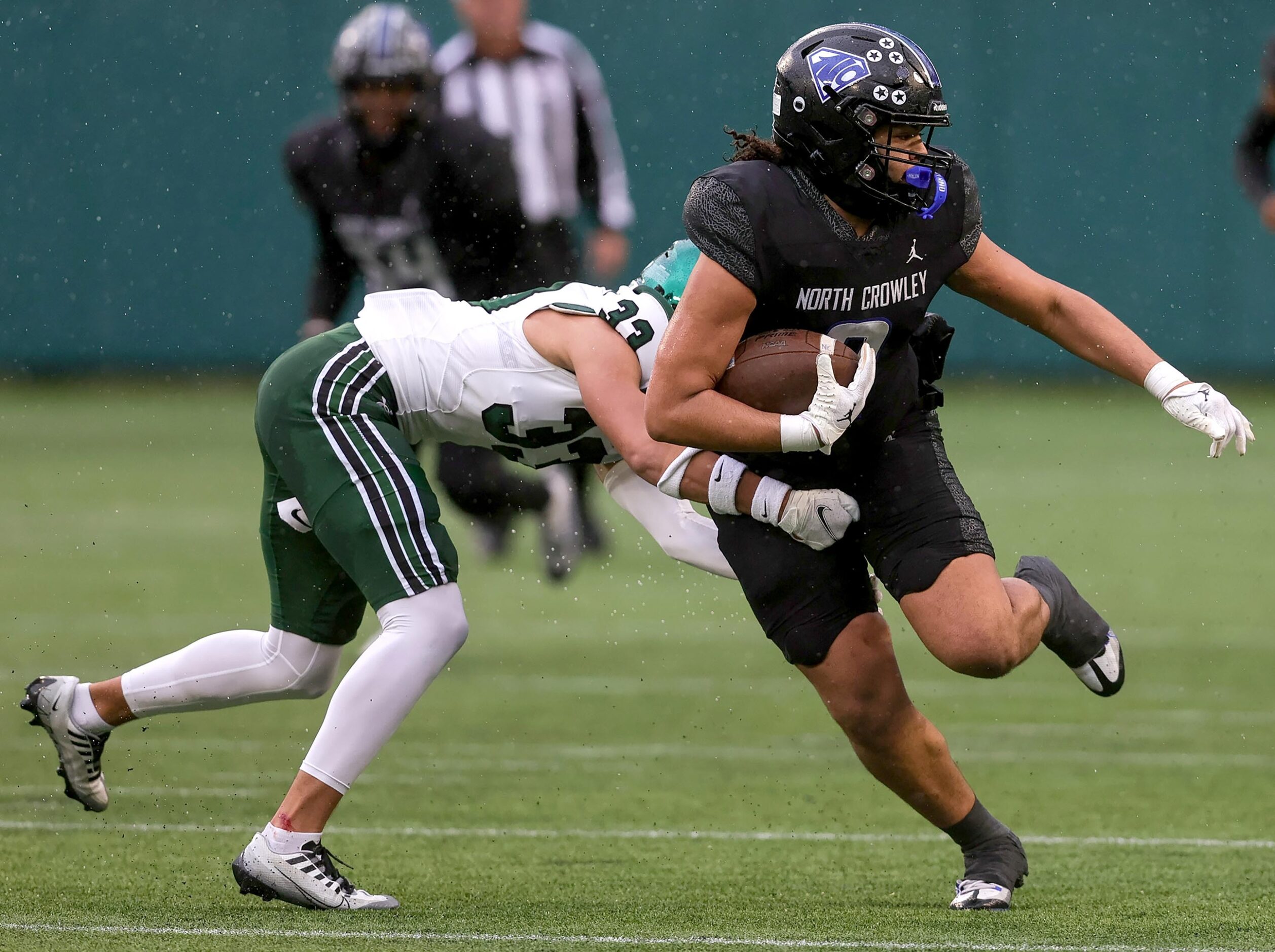 North Crowley tight end Madarrius Brooks, (right) breaks a tackle from Prosper defensive...