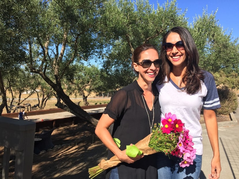 Opening day at Liana Estates, sisters Ariana (left) and Lisa pose for pictures and discuss...