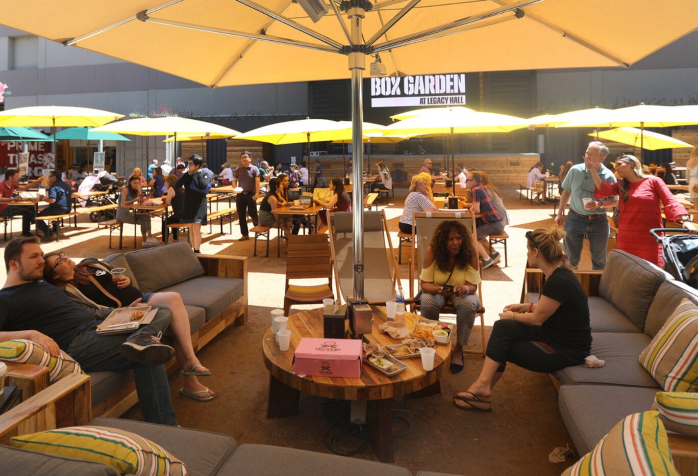 Diners enjoy the patio at the Box Garden at Legacy Hall, part of Legacy West in Plano,...