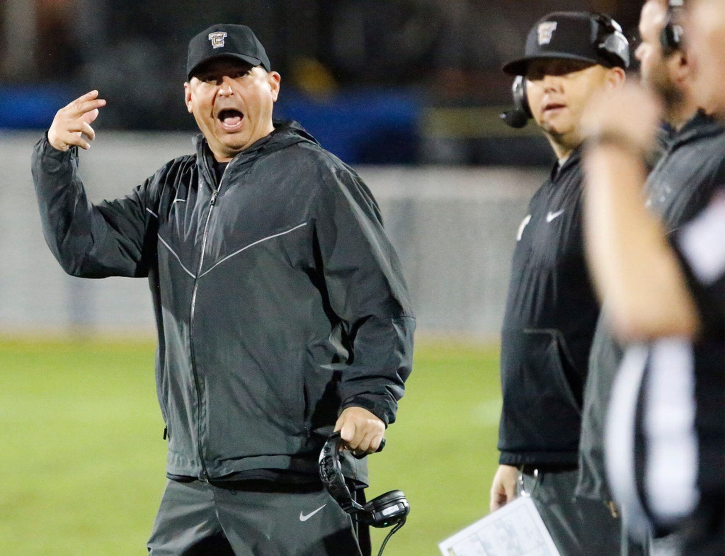 The Colony High School head coach Rudy Rangel tries to make his point to a referee during...