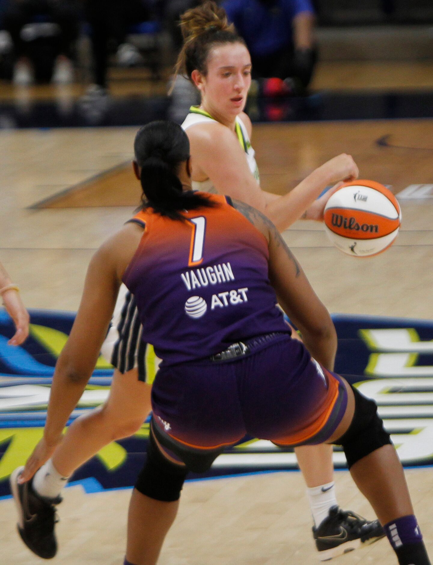 Dallas guard Marina Mabrey (3) drives the top of the key as she is defended by Phoenix...