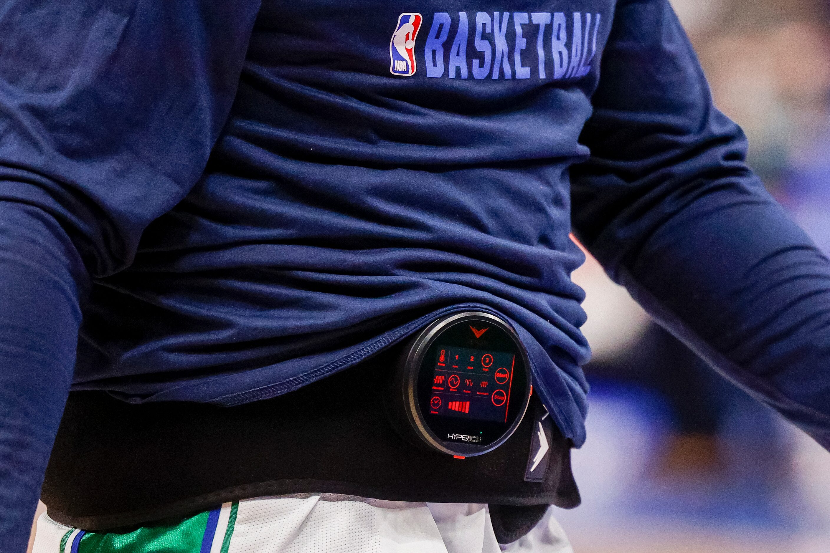 Dallas Mavericks guard Luka Doncic (77) wears a heat pack during pregame warmups at the...