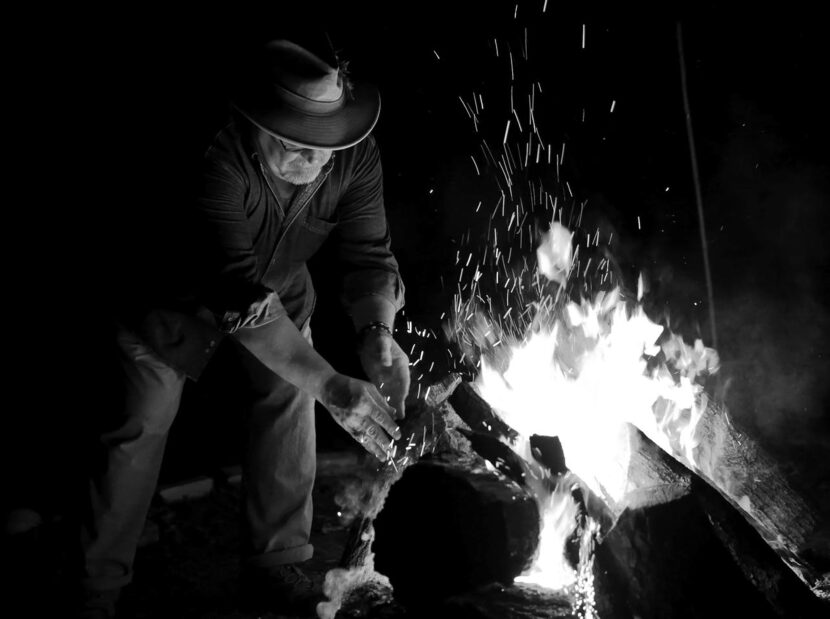 Fritz Kuehn helped  to keep things warm by building the yule log during the celebration