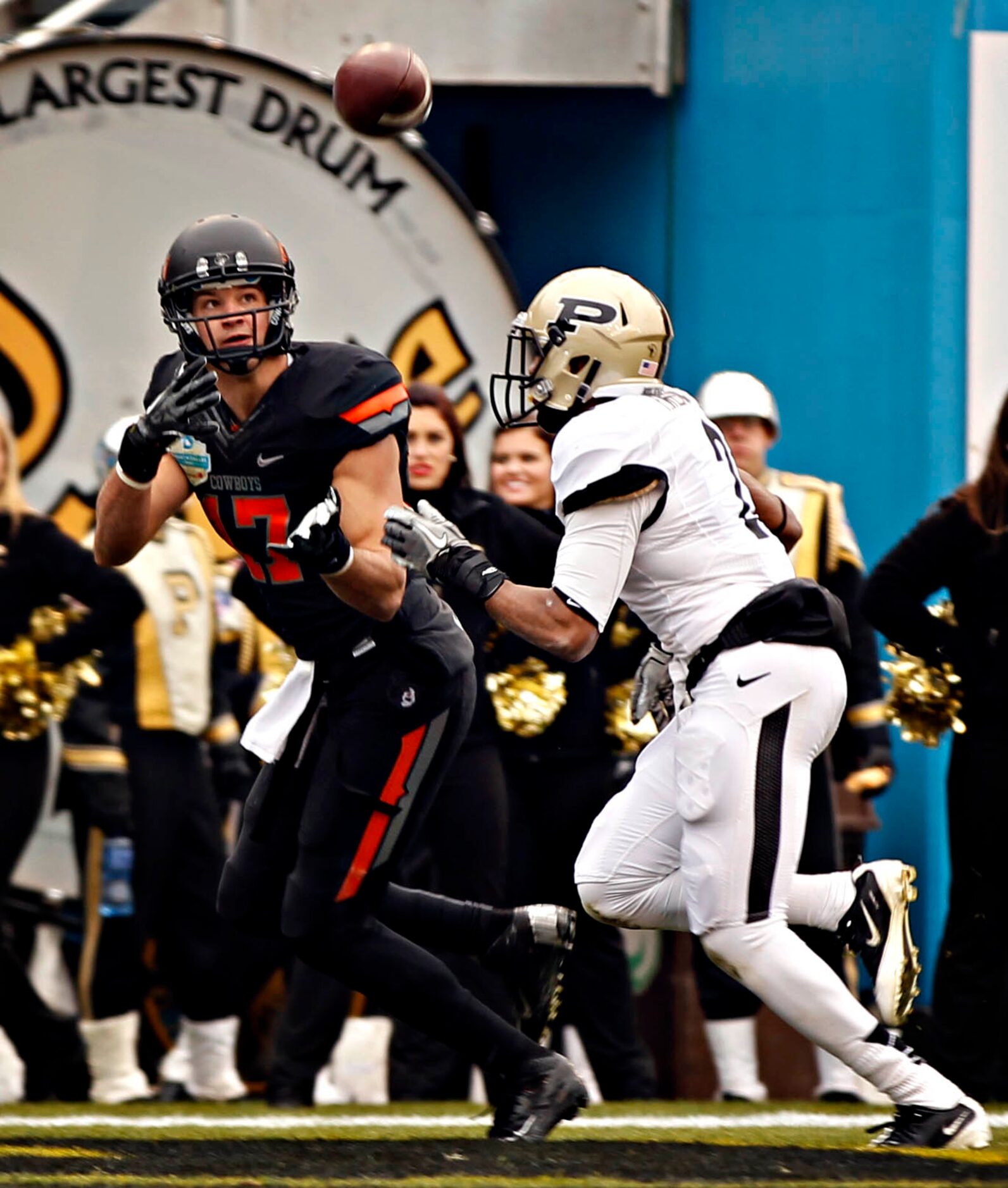 Oklahoma State Cowboys wide receiver Charlie Moore (17) catches a touchdown pass over Purdue...