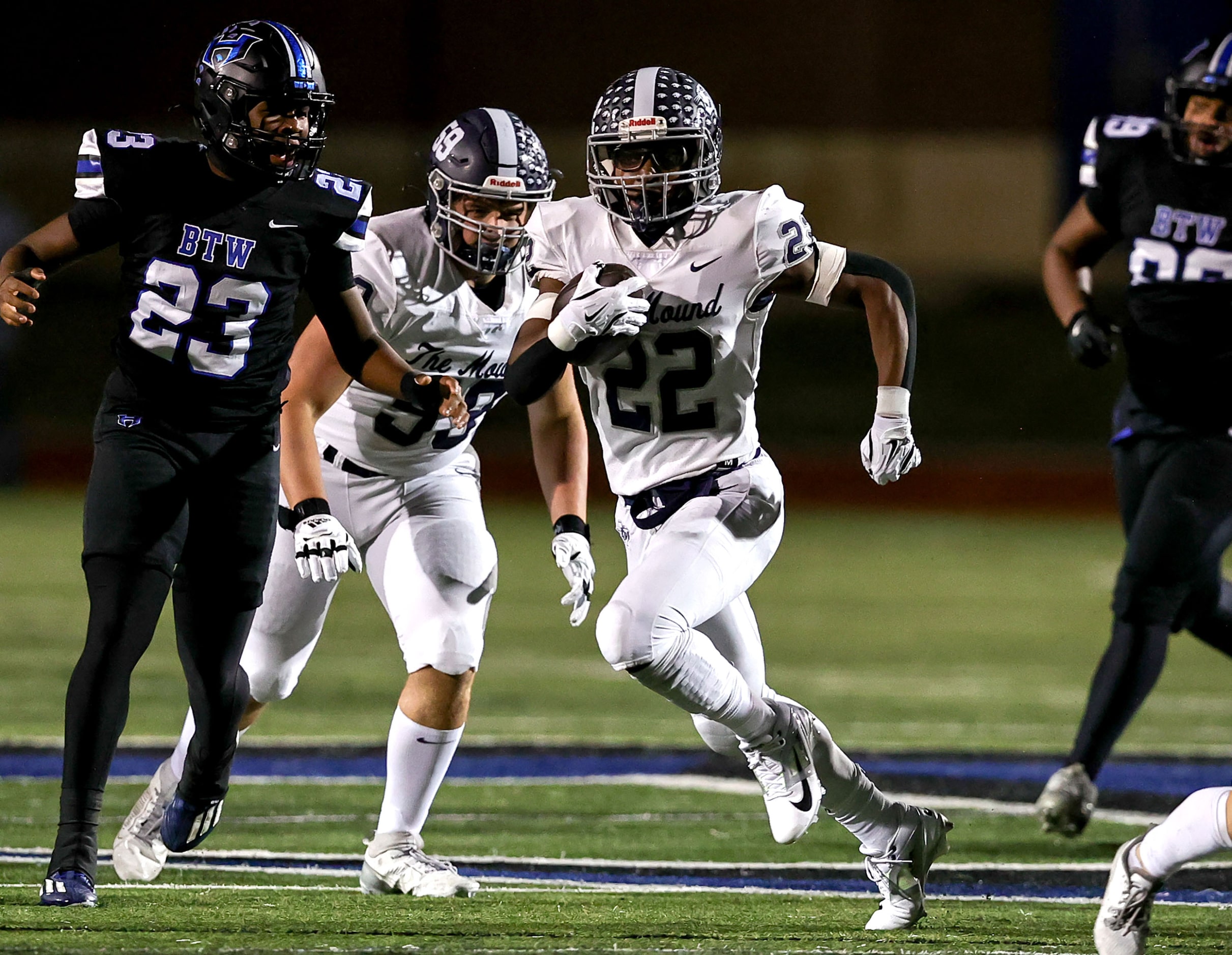 Flower Mound running back Marcus Simpson (22) finds a big hole to run for a 48 yard...