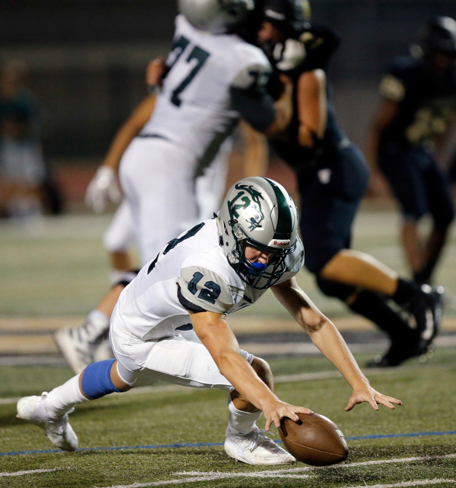 Frisco Reedy quarterback AJ Padgett (12) falls on his fumble during the fourth quarter...