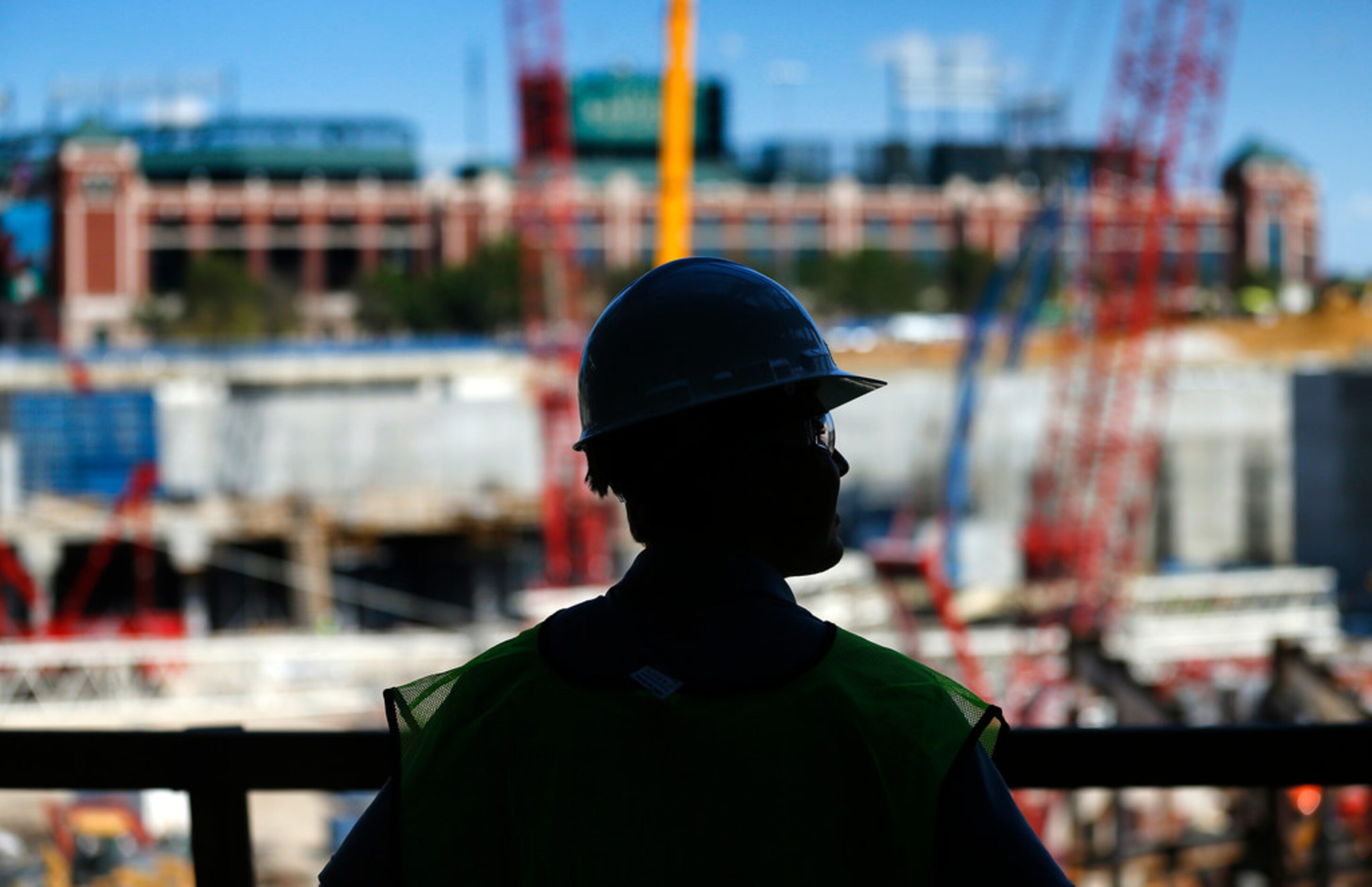 A man looks across at the new Globe Life Field under construction in Arlington, Texas,...