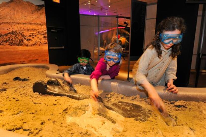 
The traveling exhibit also includes an 11-by-15-foot dig pit where kids can search for...