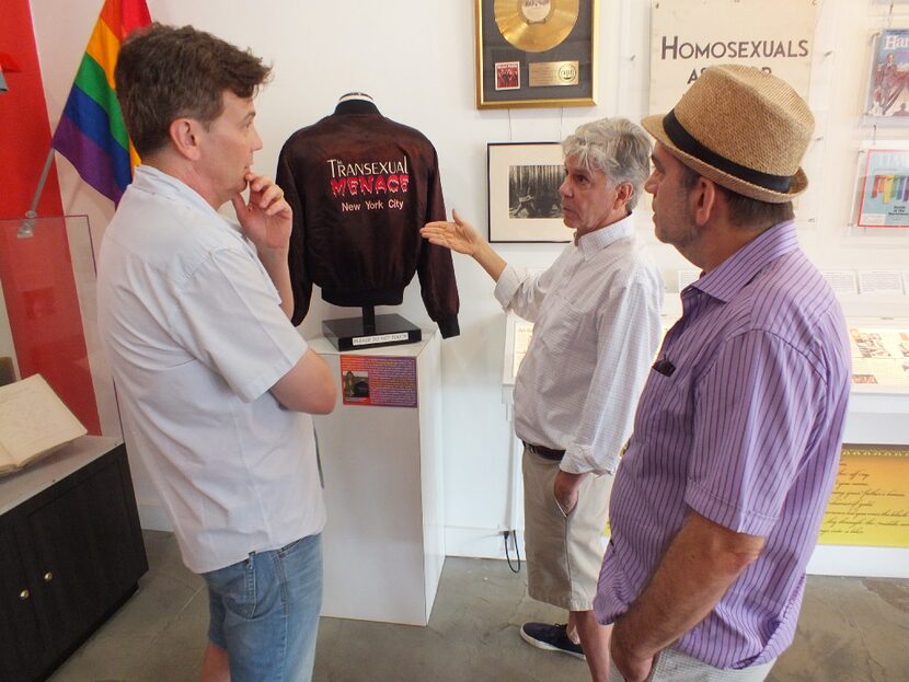 Brian McNaught (center), an adviser to the Stonewall National Museum, gestures to a jacket...