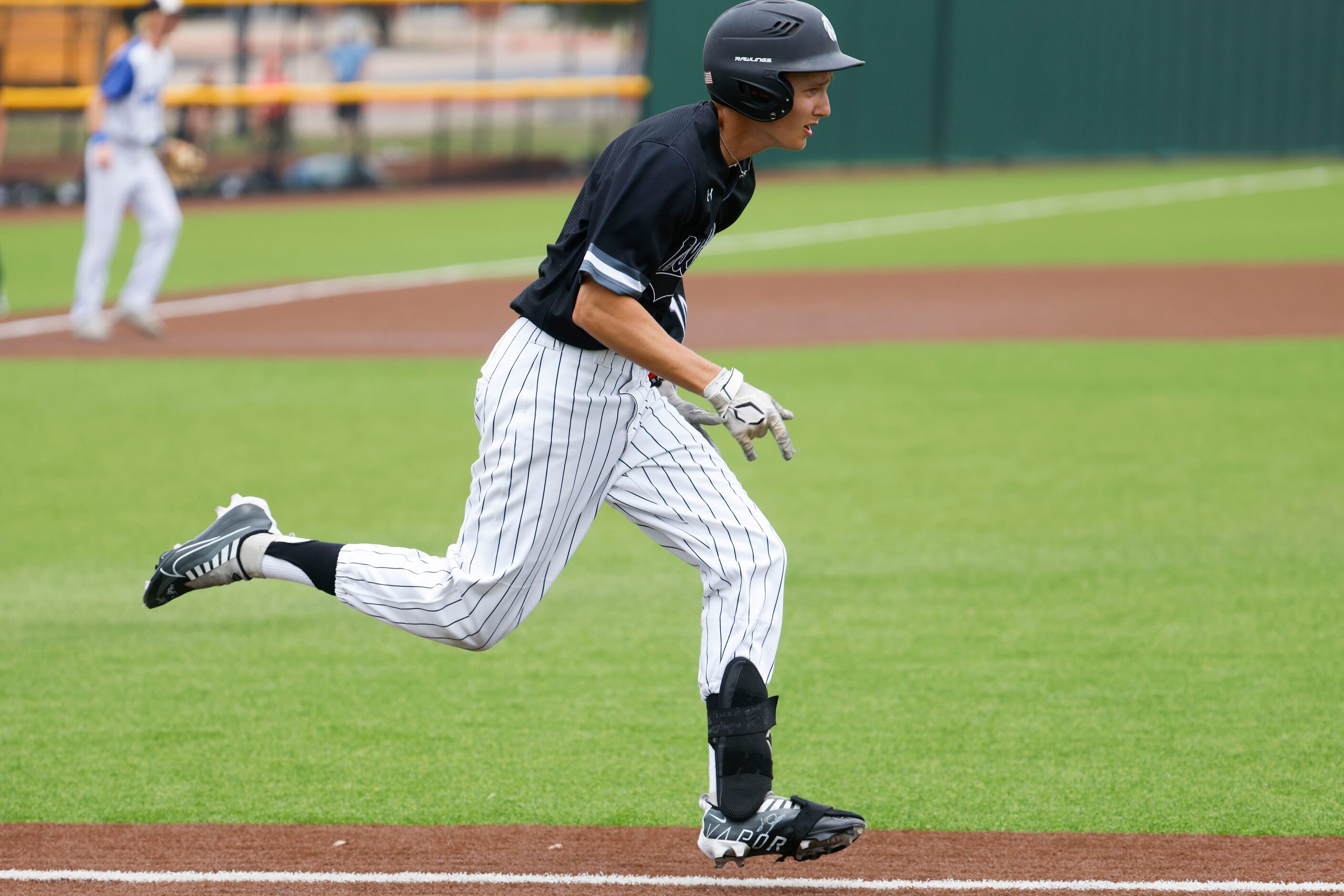 Denton Guyer’s Hunter Gural runs to the first base during the third inning of a baseball...