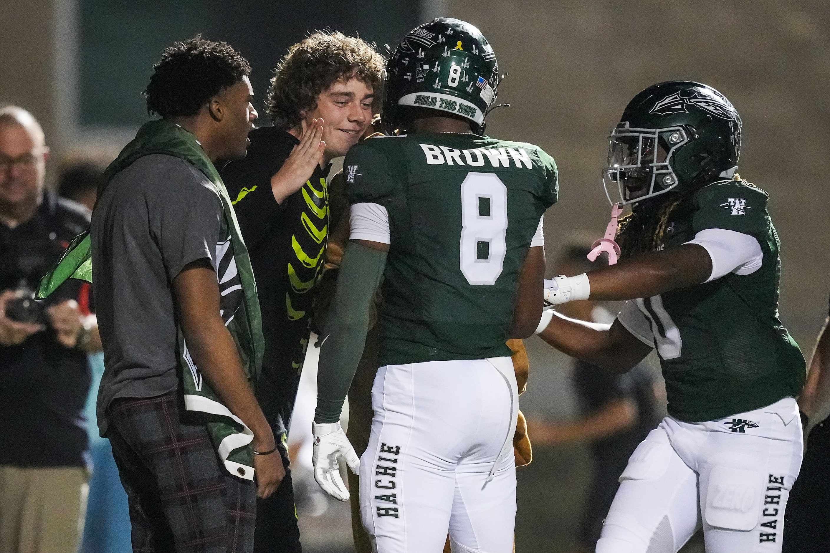 Waxahachie’s Kohen Brown (8) celebrates after scoring on a touchdown play during the first...