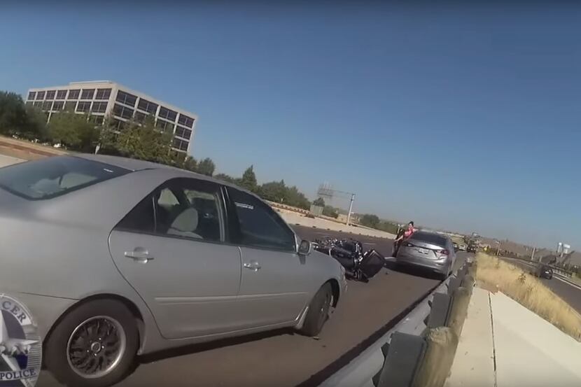 Irving Police Officer Sam Hall's body camera shows a silver sedan that had swerved onto the...