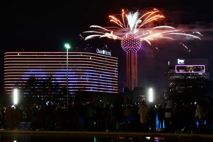 Fireworks from Reunion Tower ring in the new year during the New Year's Eve Party on the...