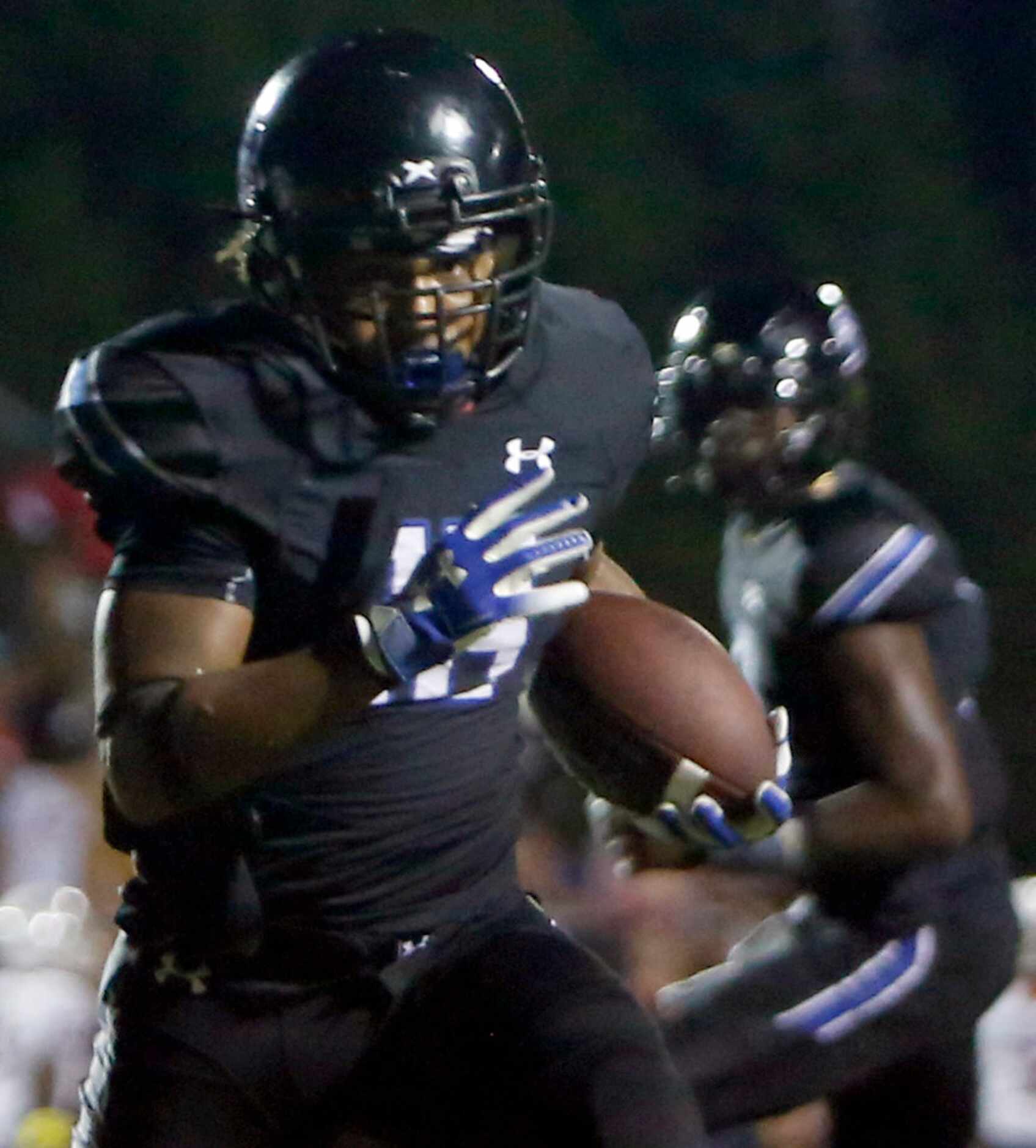 Trinity Christian running back Emari Matthews (18) rambles for a 6-yard rushing touchdown...