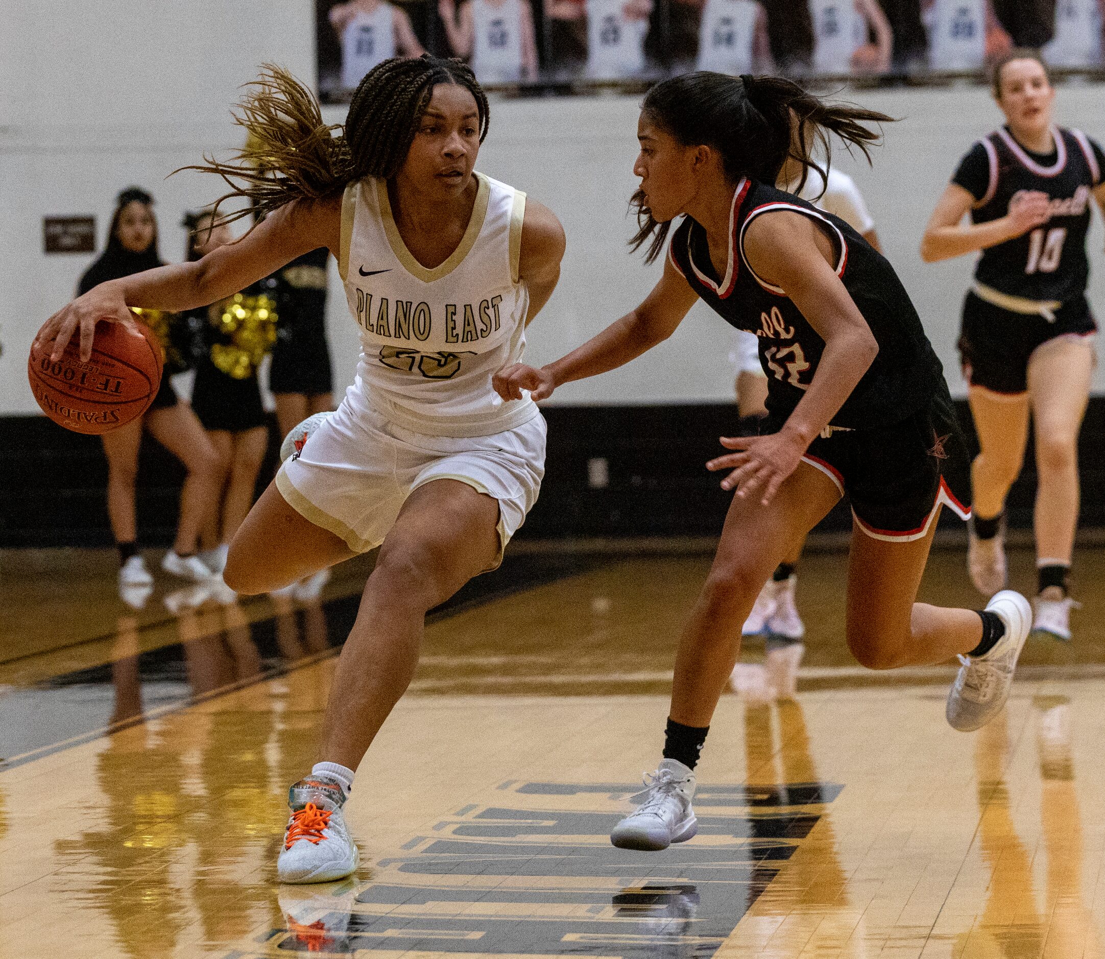 Plano East High School Donavia Hall (23) dribbles the ball up the quart during the second...