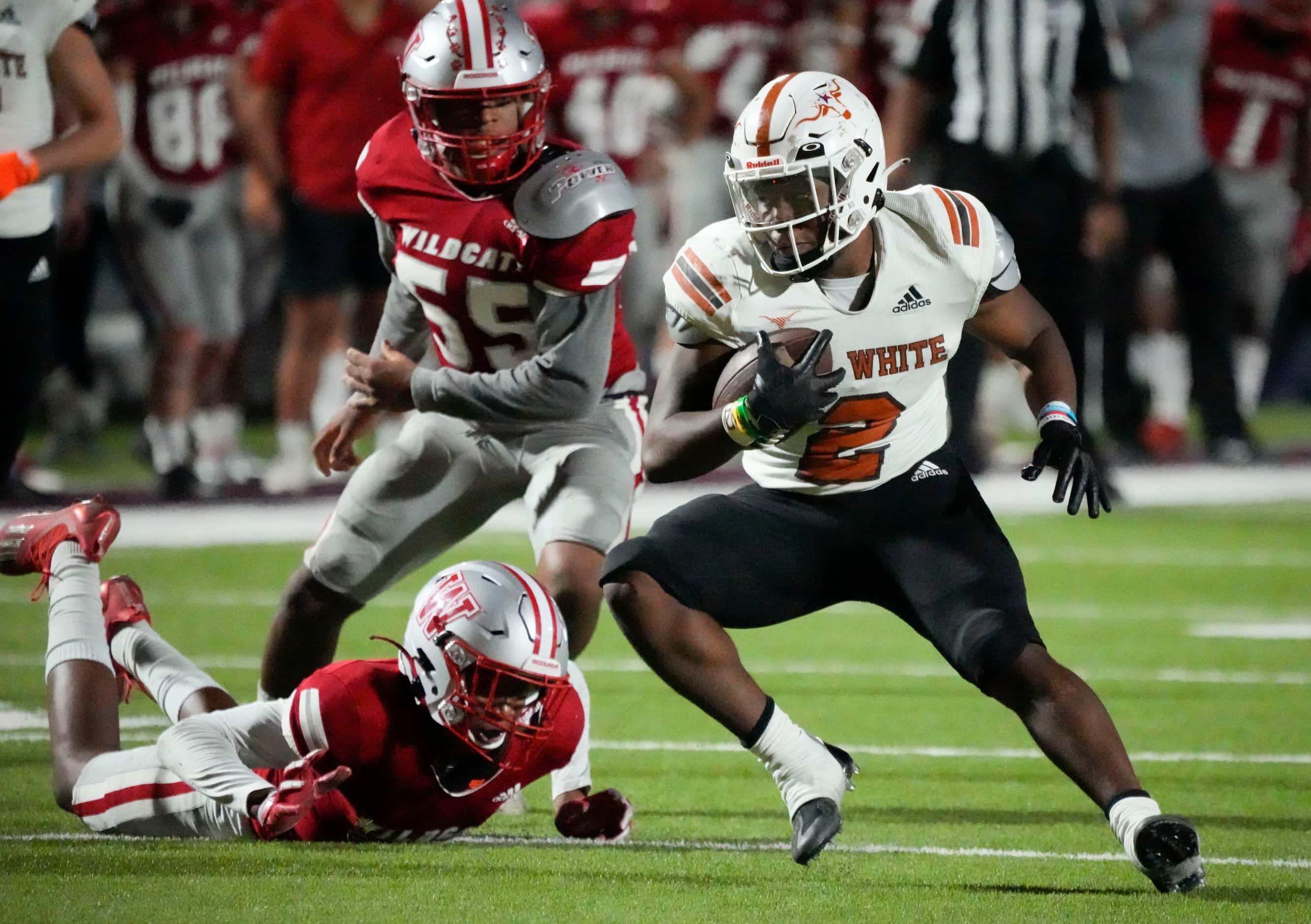 W.T. White Daviawn Bishop (2) looks for room against the Woodrow Wilson defense during the...