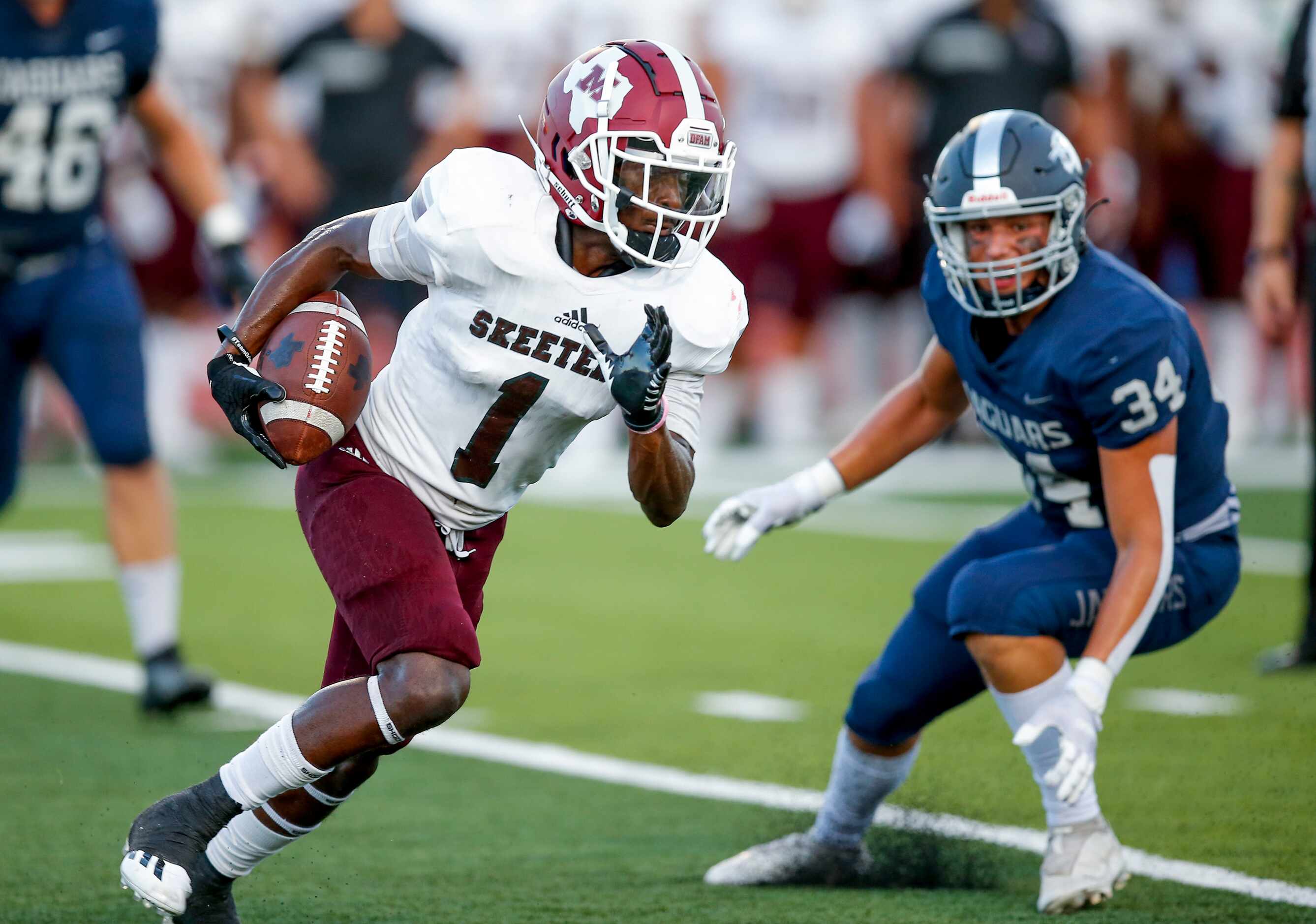 Mesquite senior wide receiver Justin White (1) looks for room against the Flower Mound...