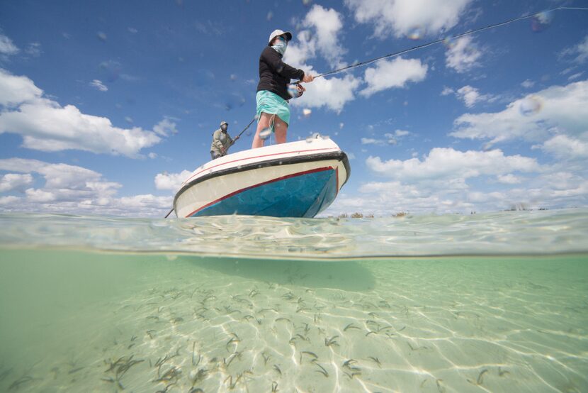 Bonefish Ebbie David and Lori Irwin angle the hard sand flats of Bimini's estuary. Bimini is...