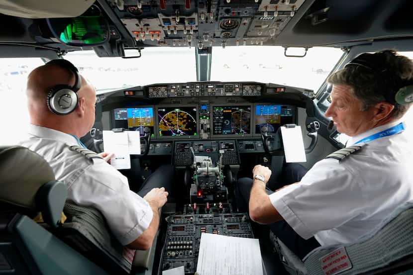 FILE - American Airlines pilot captain Pete Gamble, left, and first officer John Konstanzer...