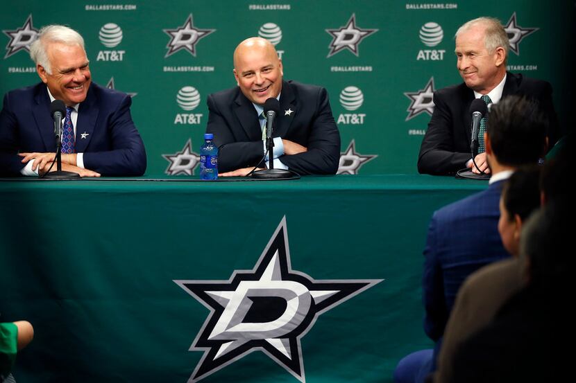 New Dallas Stars head coach Jim Montgomery, center, speaks next to Chief Executive Officer...