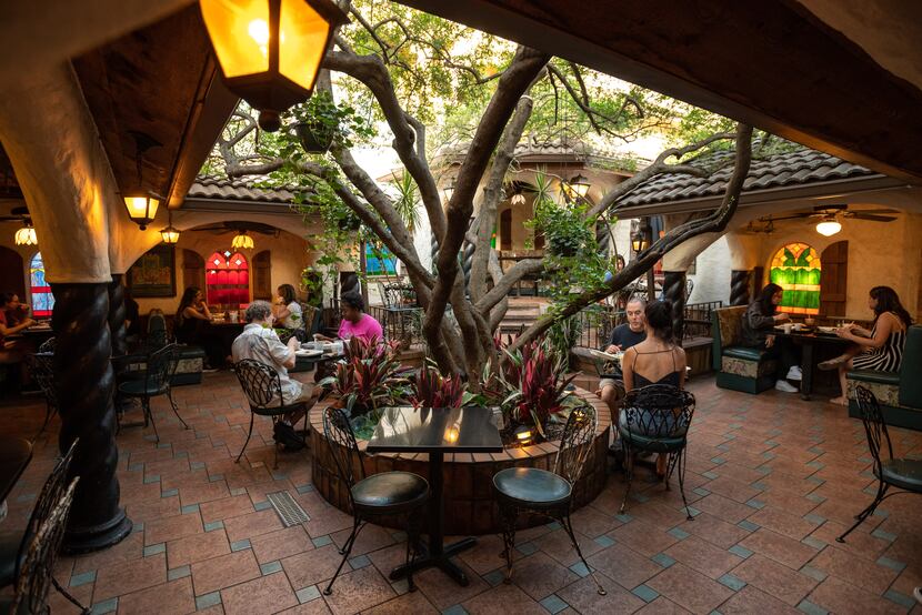 Diners outside in the patio area at Kalachandji's vegetarian restaurant on Gurley Avenue in...
