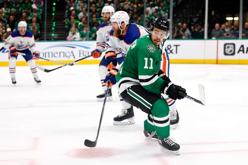 Dallas Stars center Logan Stankoven (11) watches the puck as he skates back during the third...