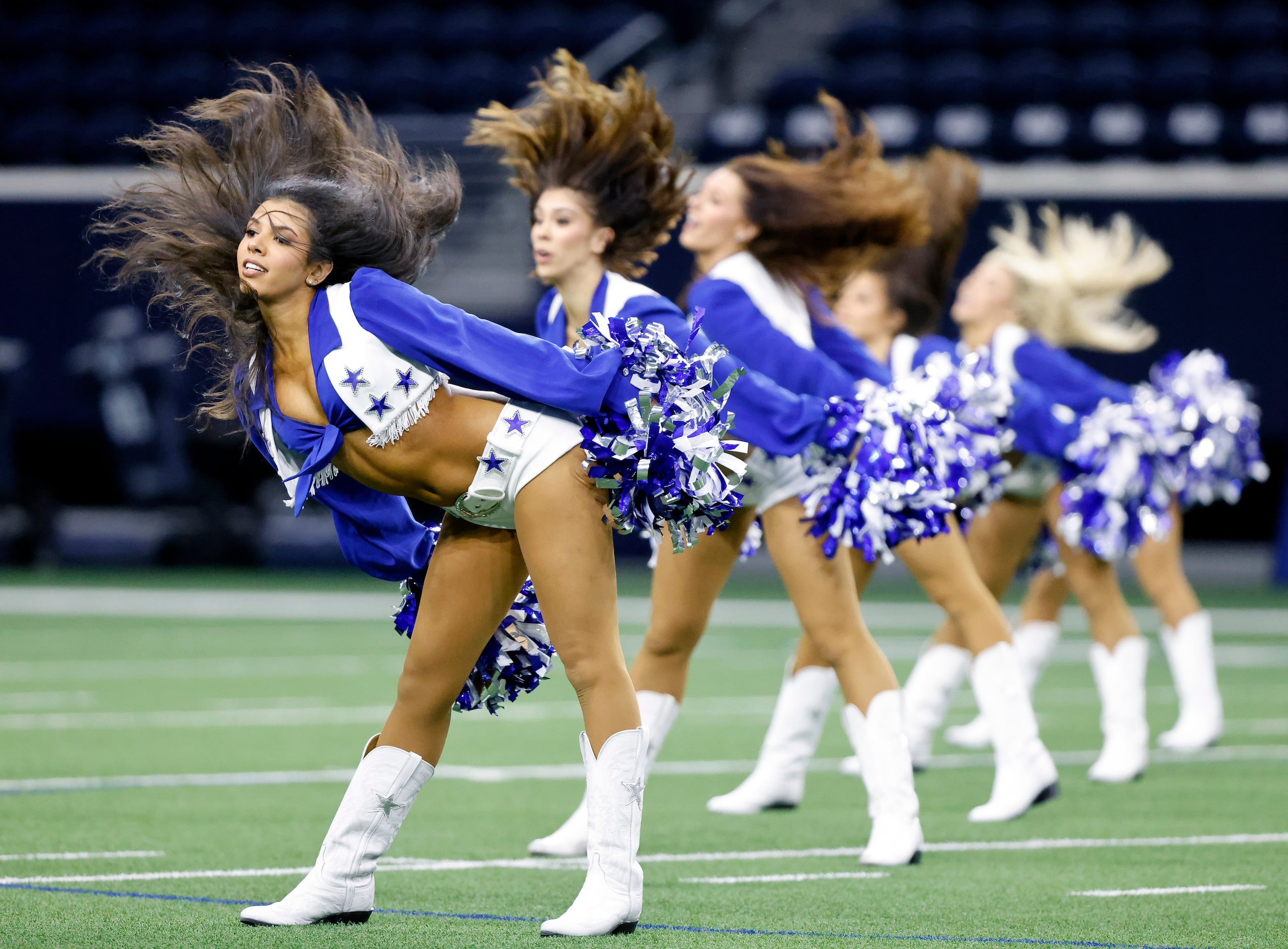 The Dallas Cowboys Cheerleaders perform during the Season Kickoff training camp practice at...