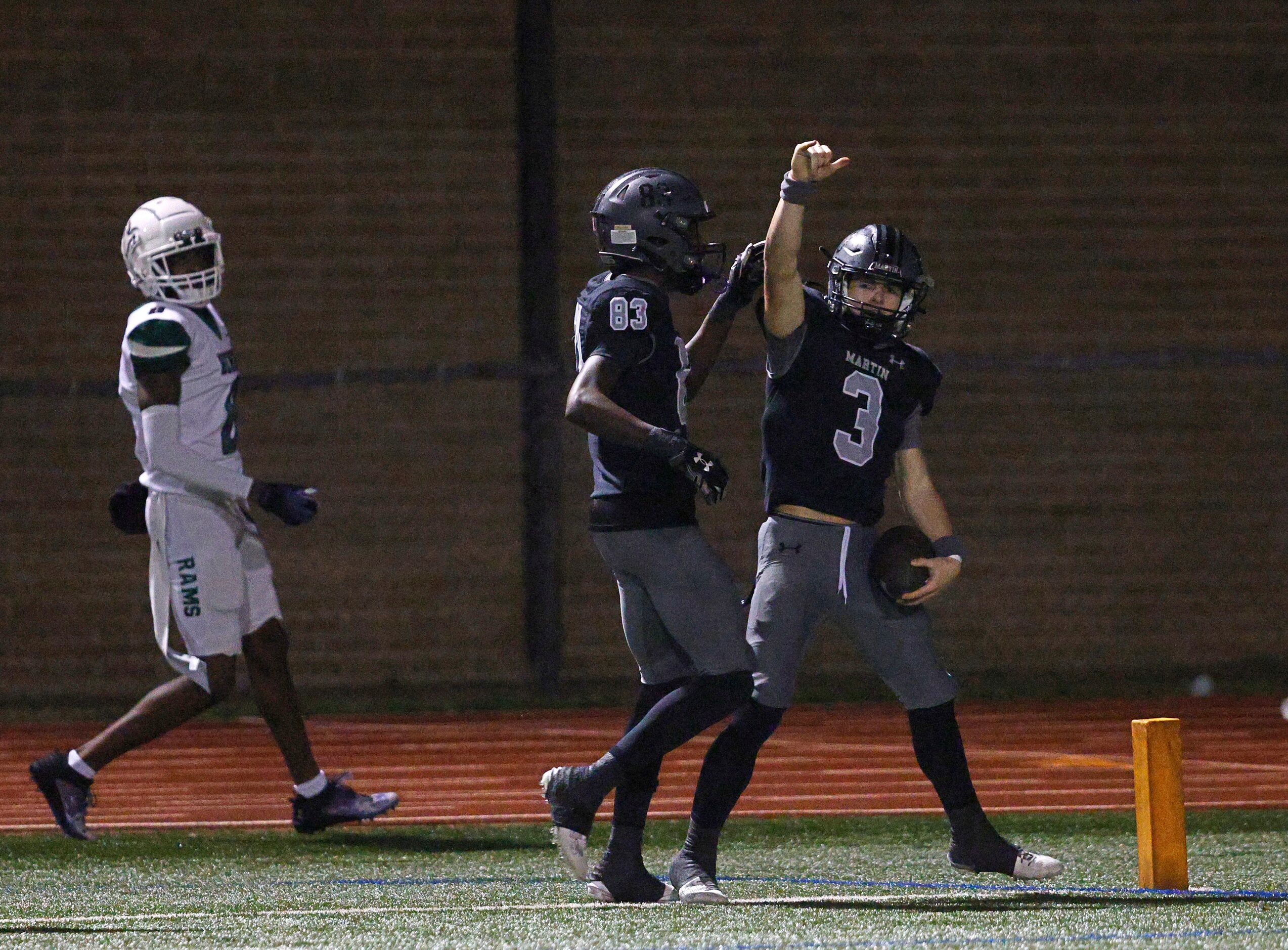 Martin's Brooks Brigand (3) celebrates his touchdown with Martin's Brody Williams (83)...