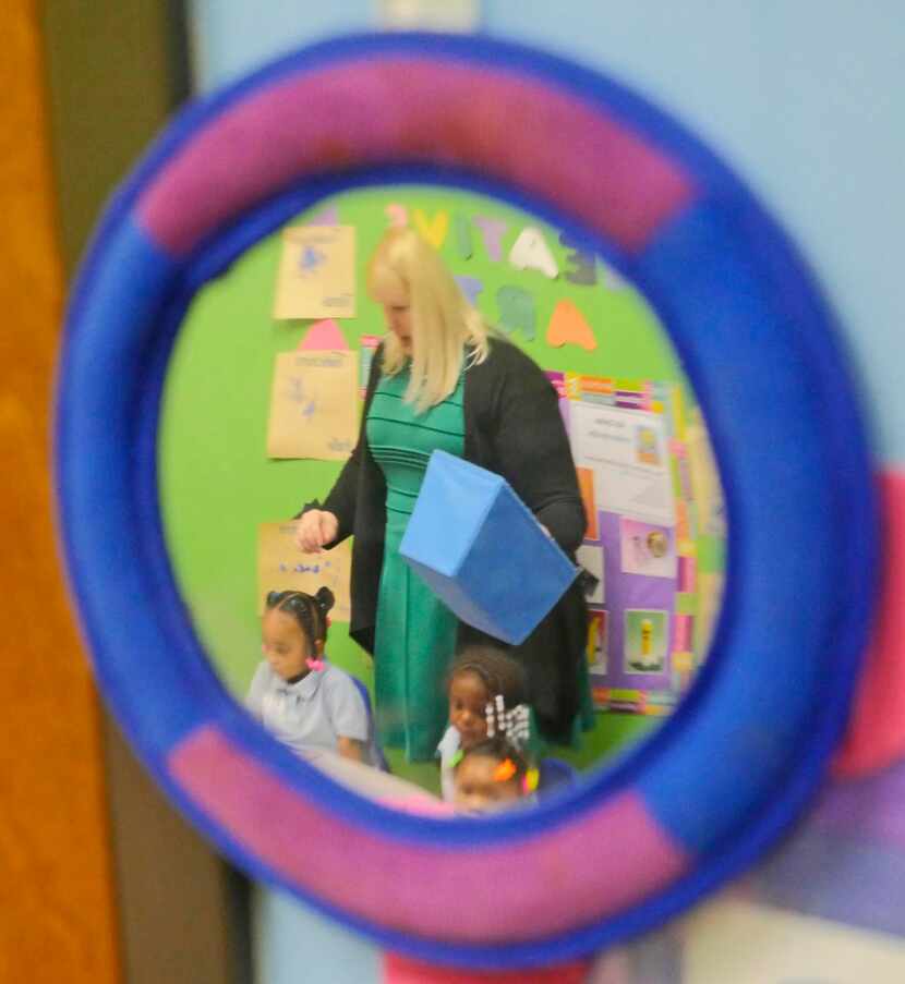 
Angela Swindell, an early learning specialist with Educational First Steps, is reflected in...
