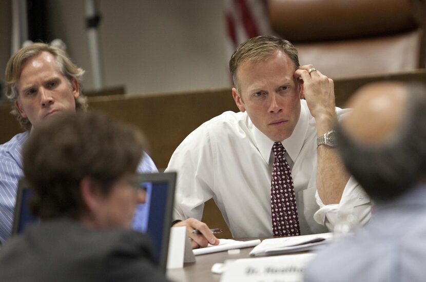 
Railroad Commissioner Ryan Sitton (center) listened to seismologists from SMU, UT-Austin...