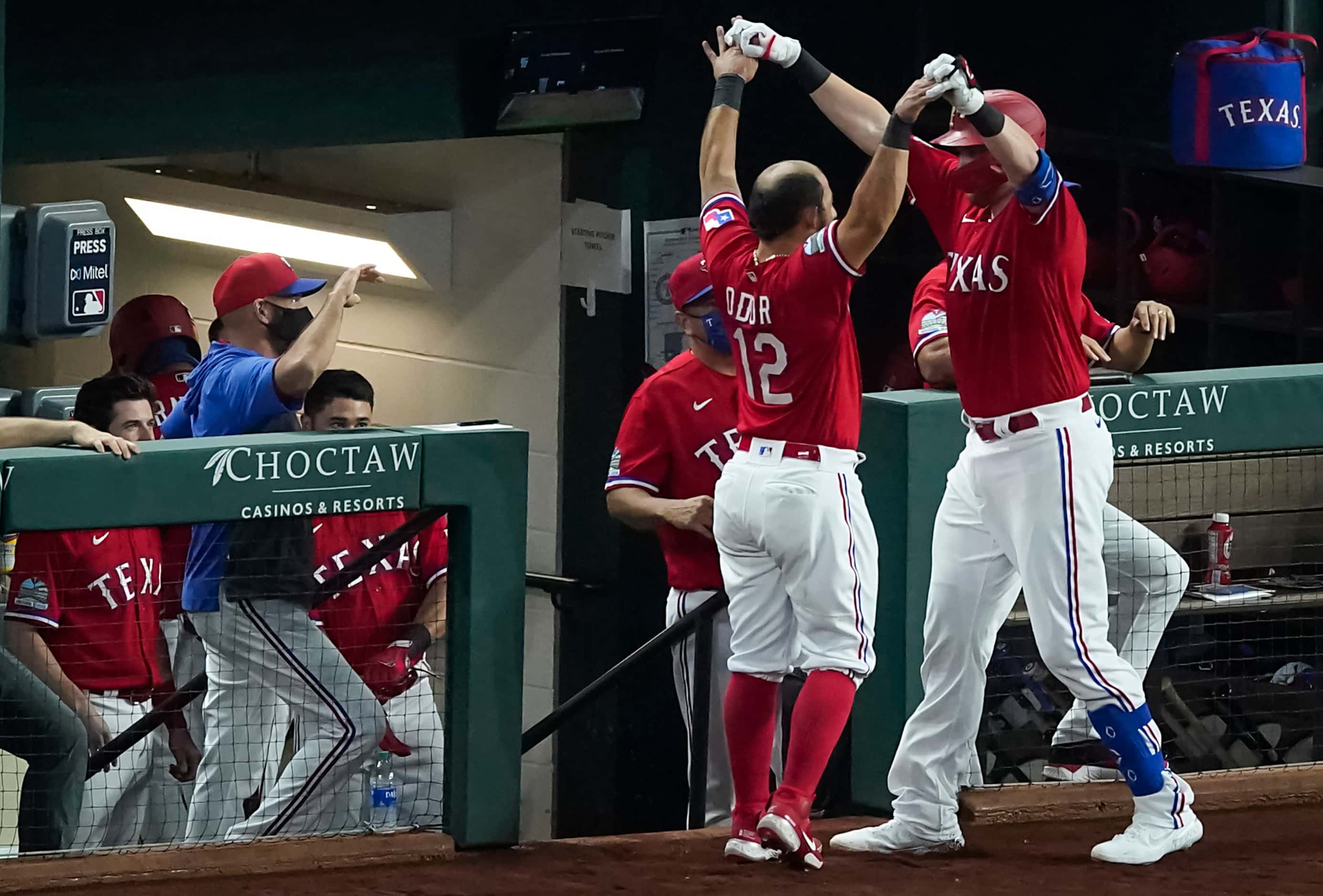 Texas Rangers catcher Sam Huff celebrates with Texas Rangers second baseman Rougned Odor...