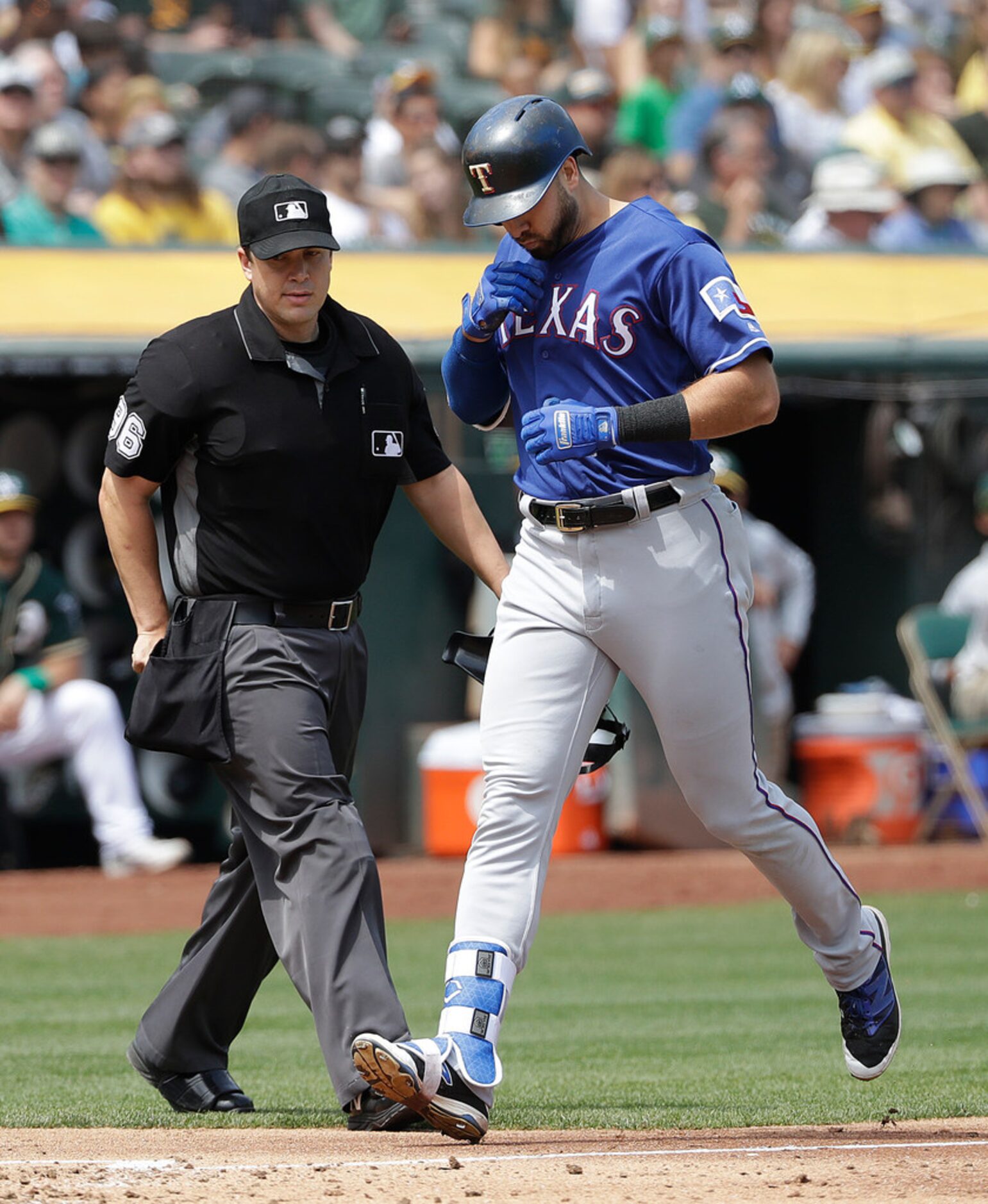 Texas Rangers' Joey Gallo, right, reacts after hitting a solo home run against the Oakland...