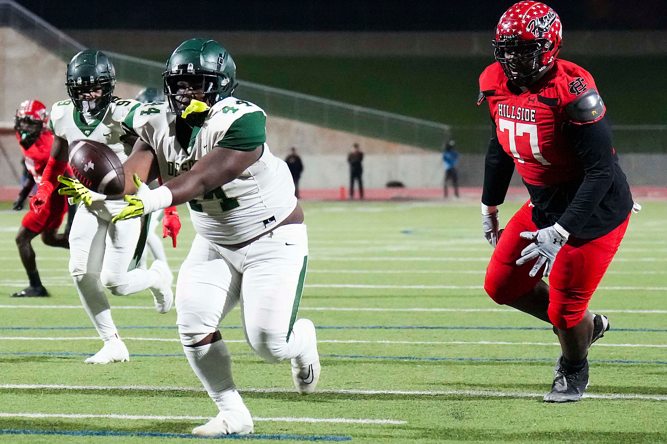 DeSoto defensive lineman Marshall Kirven (44) intercepts a pass for a touchdown in front of...