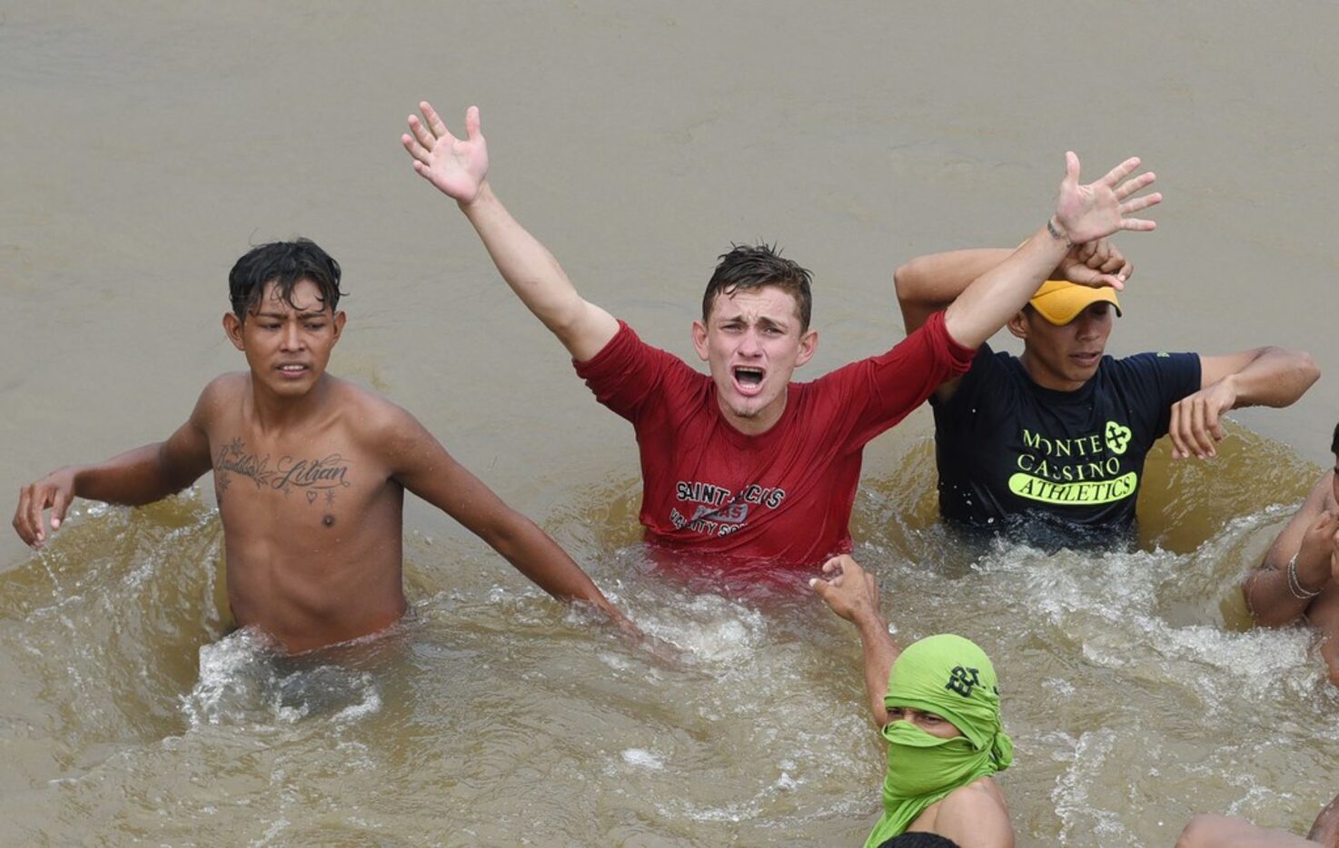 Honduran migrants heading in a caravan to the U.S. crossed the  Suchiate River from...