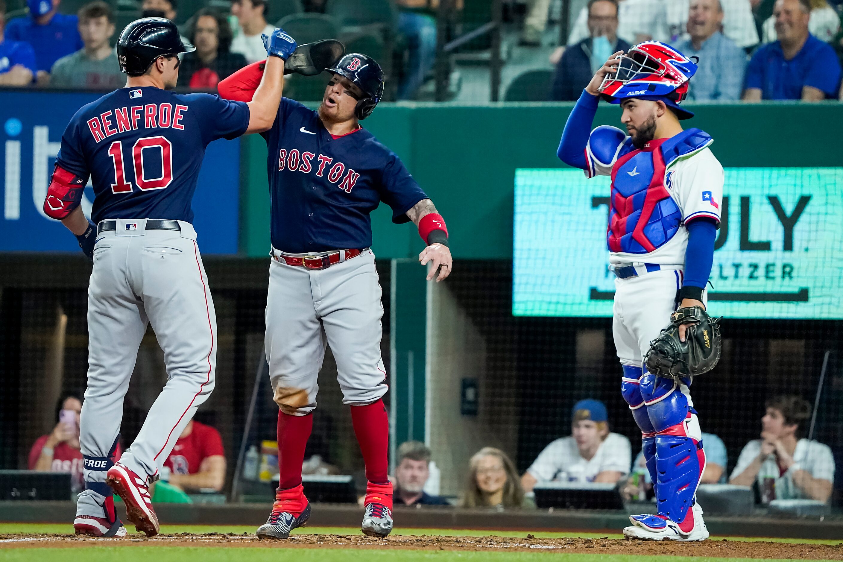 Boston Red Sox right fielder Hunter Renfroe (10) celebrates with catcher Christian Vazquez...