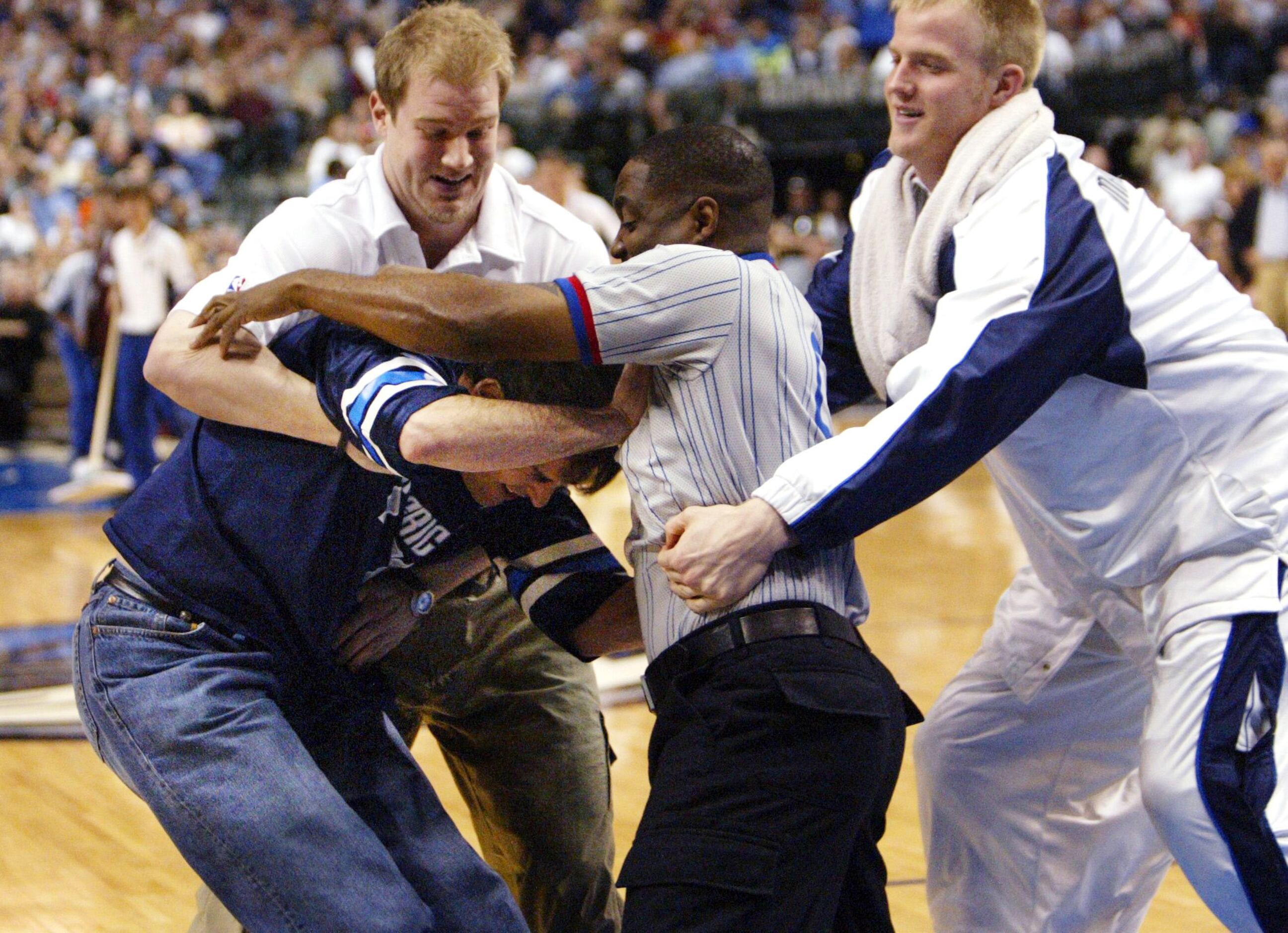 April 1, 2003:  April fools! Mavs  owner Mark Cuban fights with a referee while Mavs' Evan...