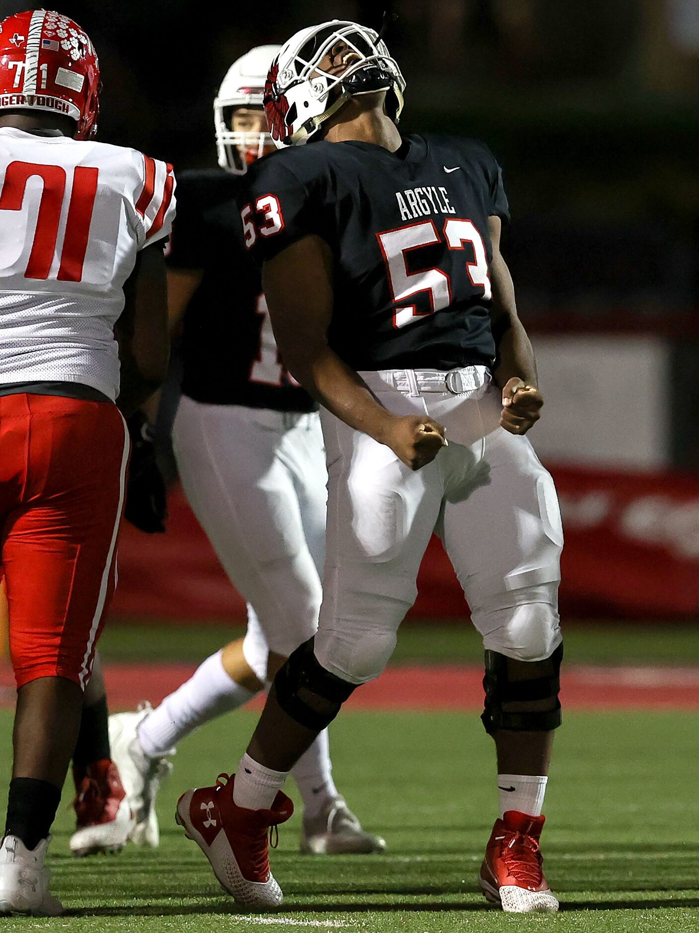 Argyle defensive lineman Jadon Scarlett (53) reacts after making a sack against Terrell...